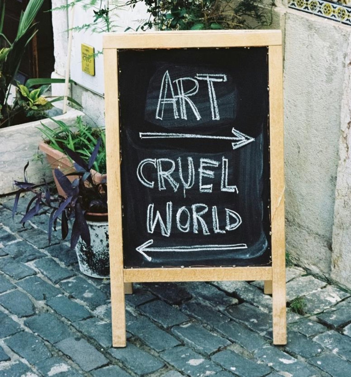 A chalkboard on a cobbled street