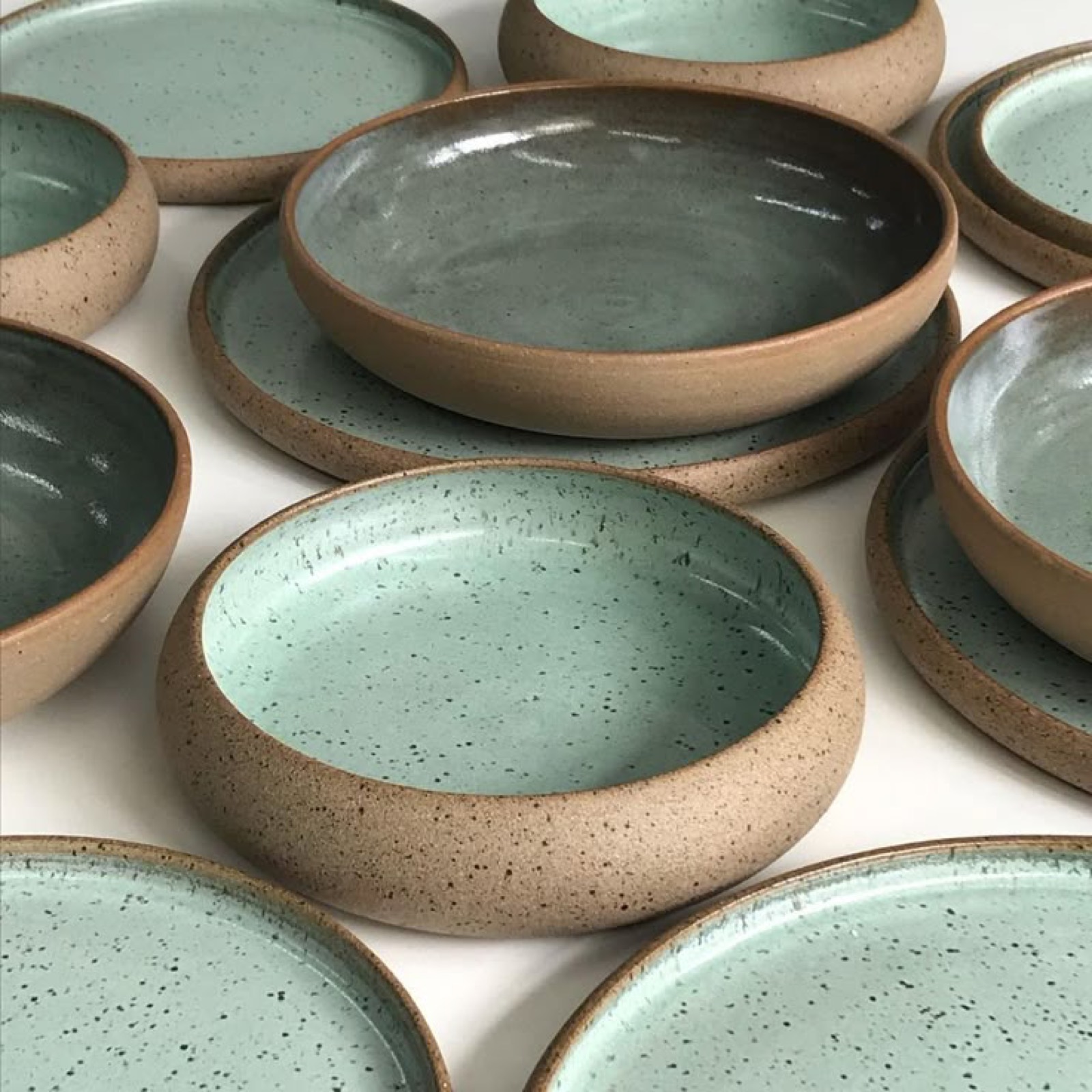 Speckled stoneware bowls and plates