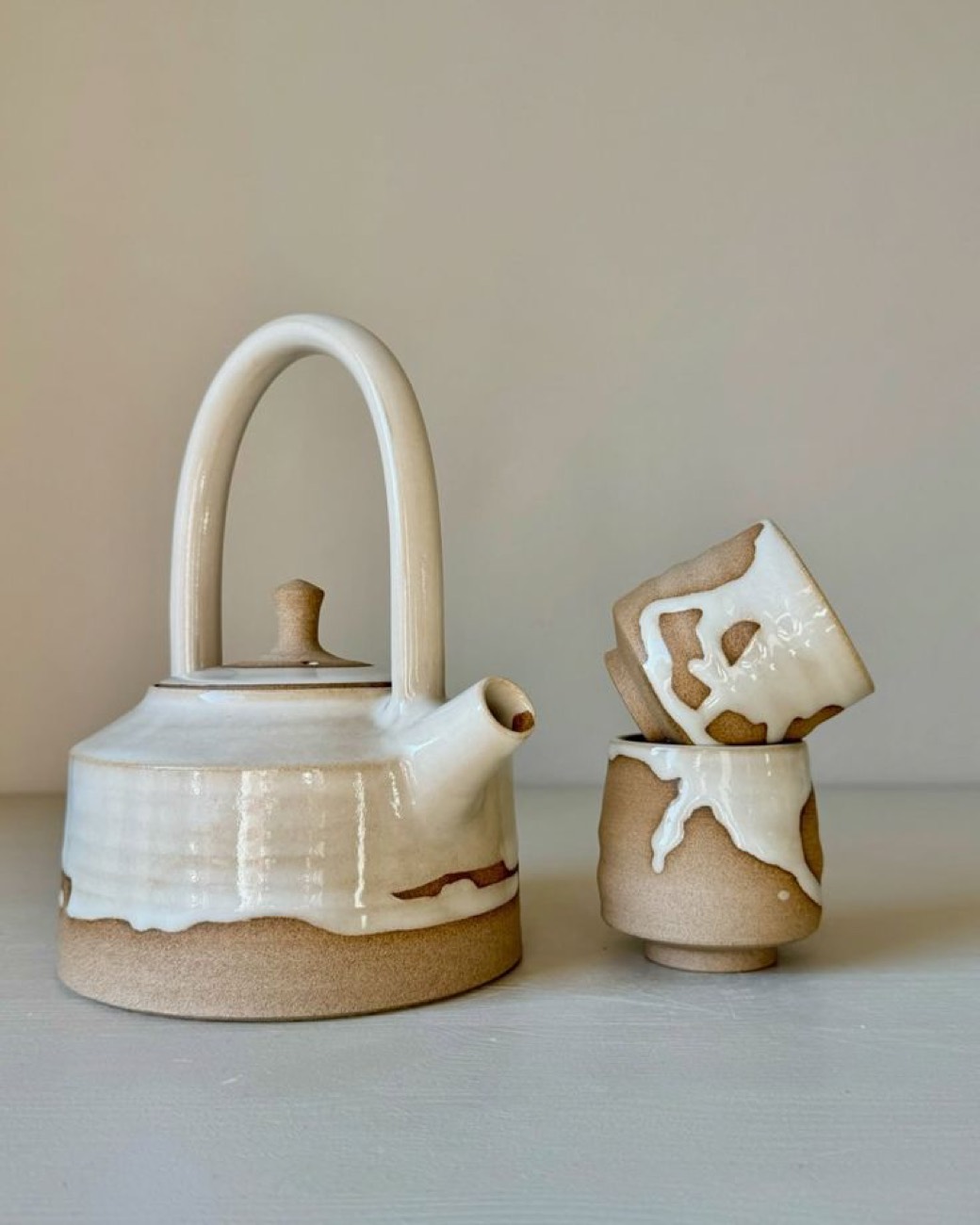 A handmade teapot and cups