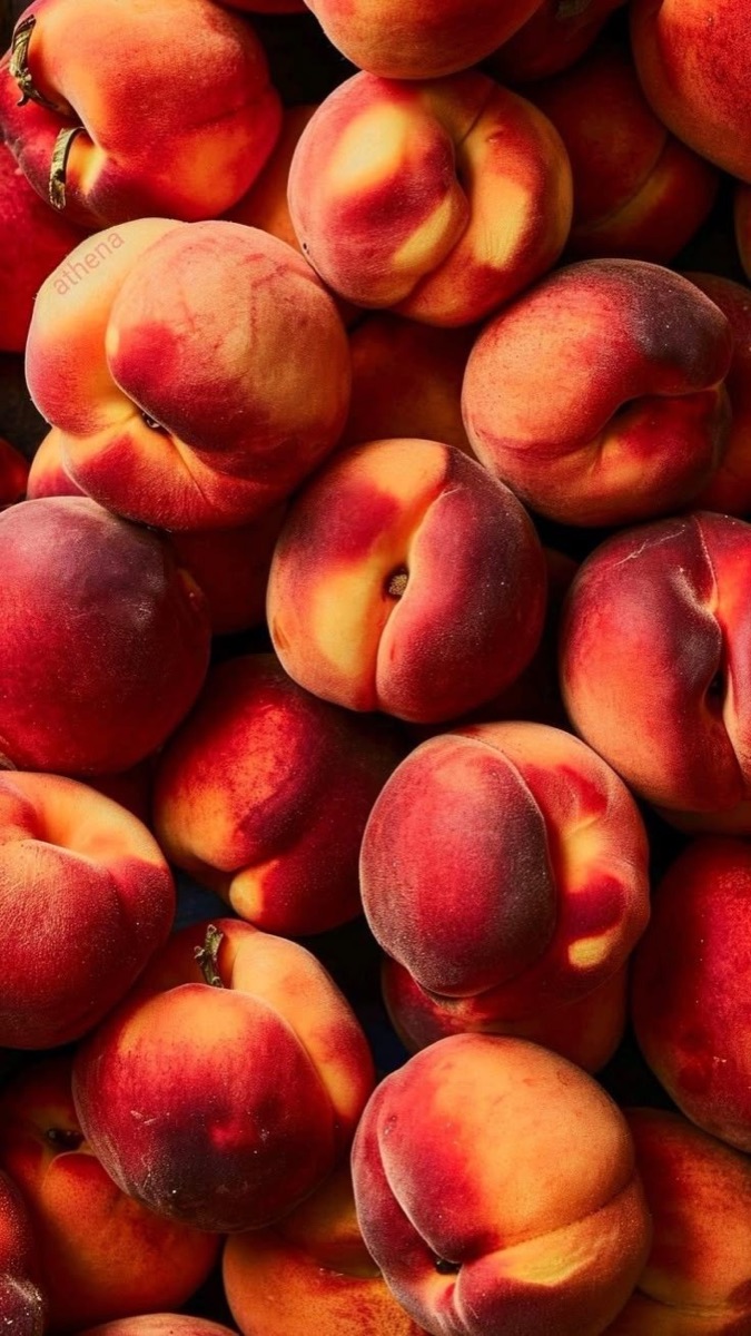 Ripe peaches piled high