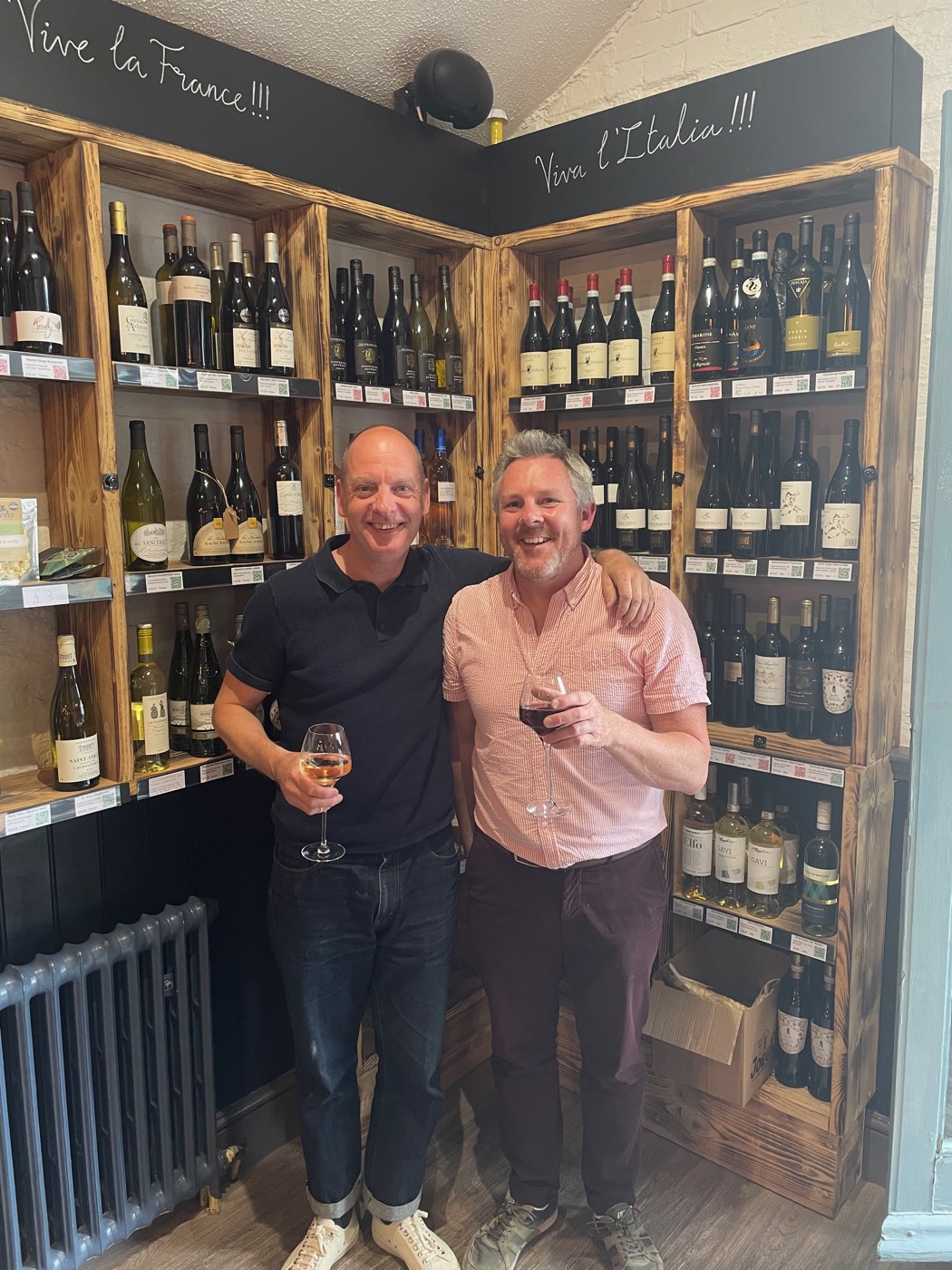 David Peevers in a wine shop, glass in hand